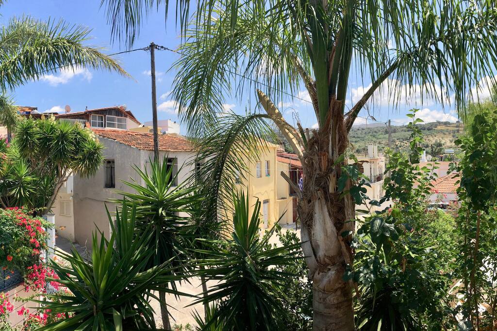 Villa Kallergi - Athena(left) & Nefeli (right) gardens between the cobblestone Loutra village alley.
