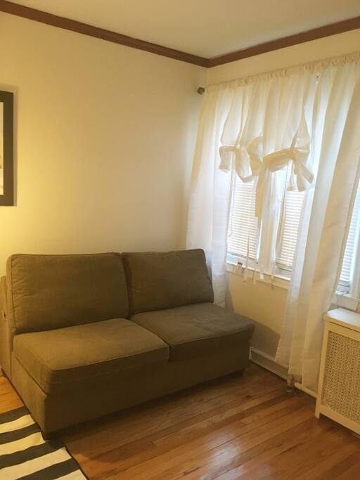 Comfy Couch with view of street.