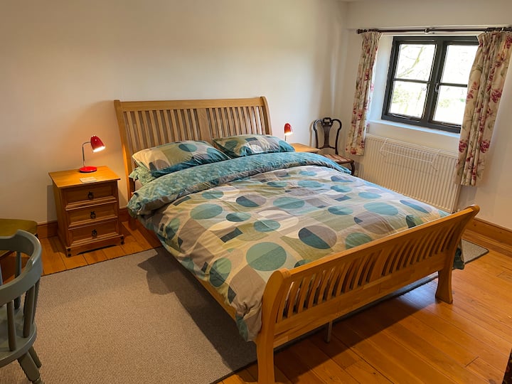 Bedroom 2 / King Sized Bed, dressing table, chair and cupboard with plenty of hanging and draw space.