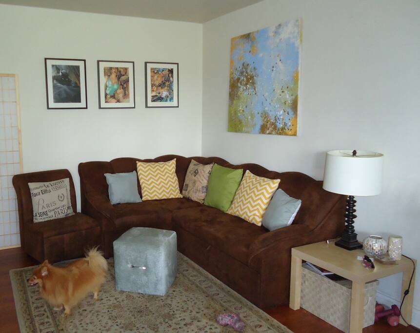 Living room comfortably seats 5 & the couch is a pull-out that fits 2 people.