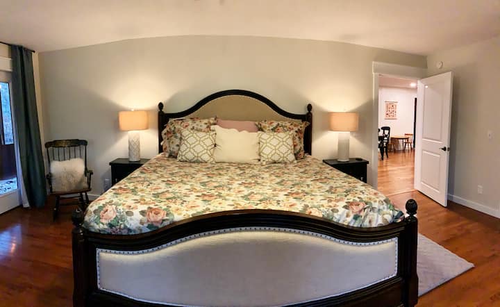 Master bedroom featuring an ultra-comfortable king bed with memory foam topper and luxurious linens.