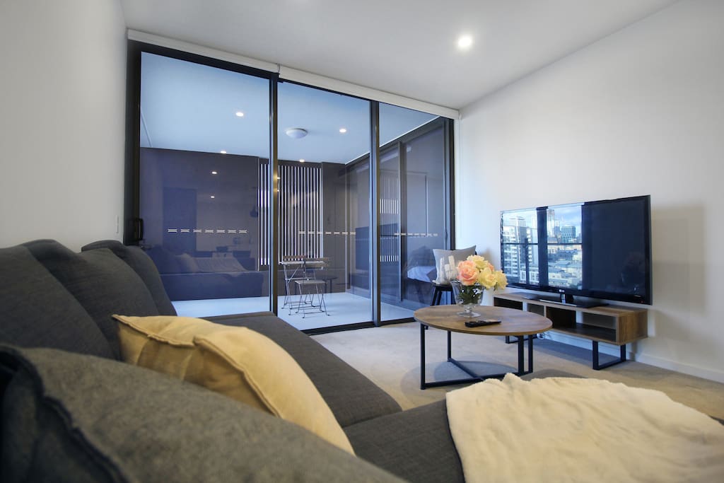 Living space with smart TV linked to wireless access to enhance the entertainment experience.