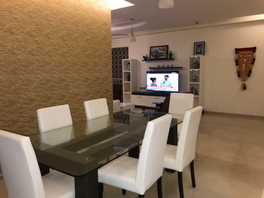 It is the Dining area and beyond that is the Living room wall in front of the Sofa you saw in 1st snap to see the large HD smart TV. The sofa at the opposite to TV is shown in the Cover Photo.
