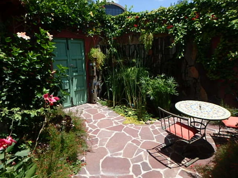 Front Entry patio, koi pond, and garden sitting area