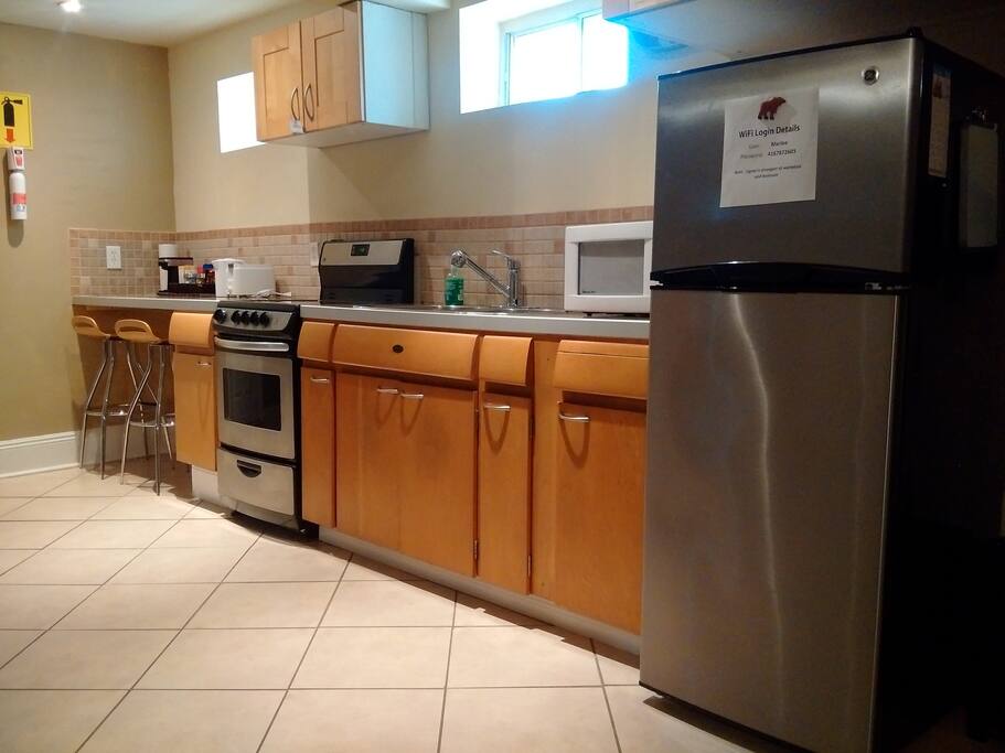 Kitchen and eating/work space with two stools.