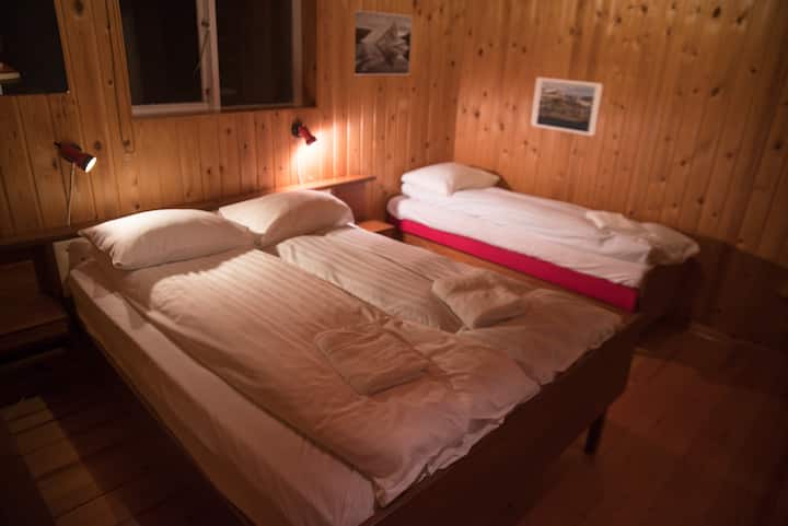 The largest bedroom, with double and single bed and can accommodate an extra bed if required