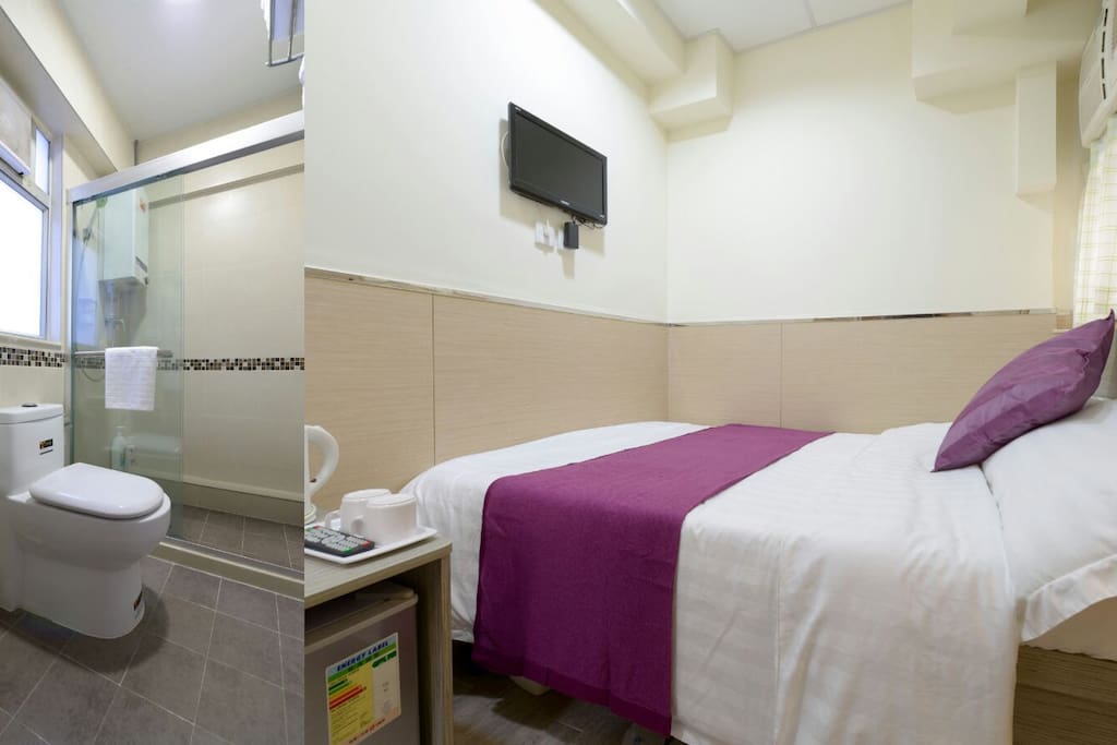 An overview of the room with a private bathroom inside