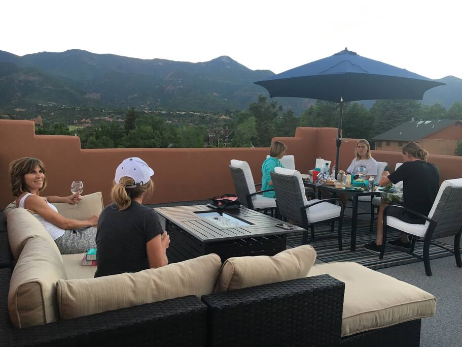 Fourth story deck with firepit for dining, lounging or watching the sunset. Best view in town.