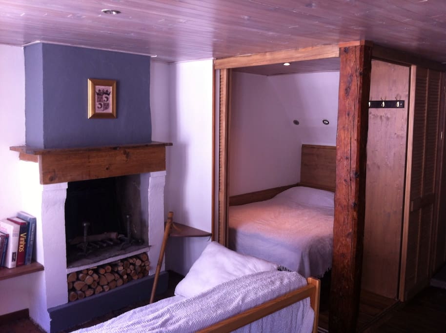 double bed with wood sliding doors opened