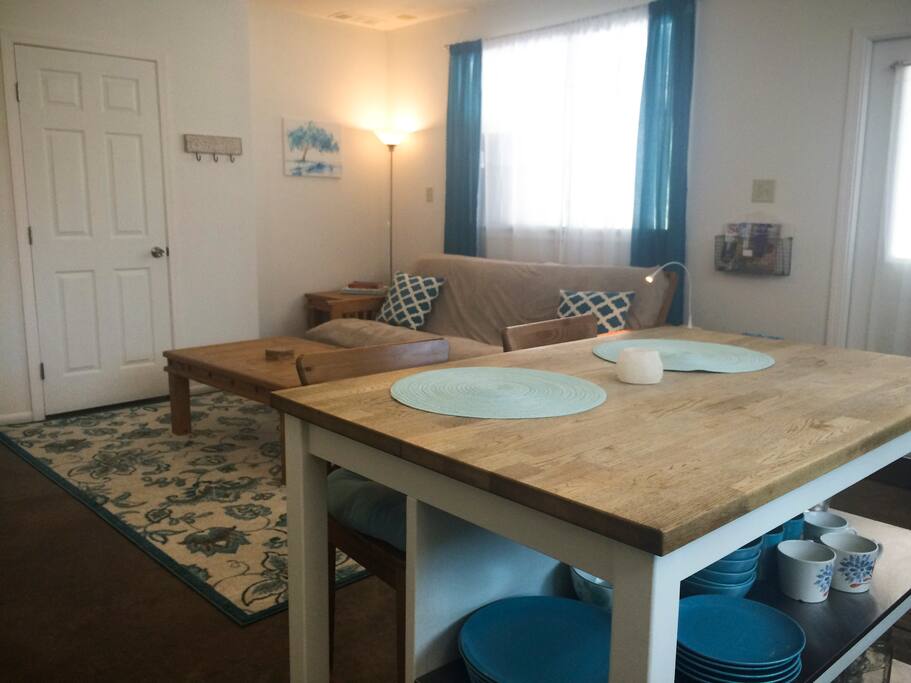 Our kitchen island provides seating and holds dishes and kitchen tools