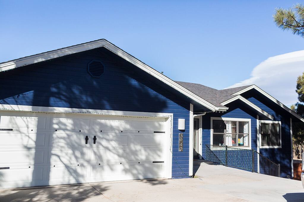 Upon arrival, look for the blue house on your left.
