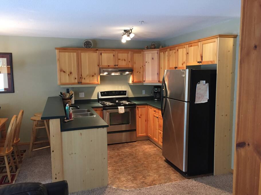 Open concept kitchen with SS Fridge,Stove and dishwasher, fully stocked