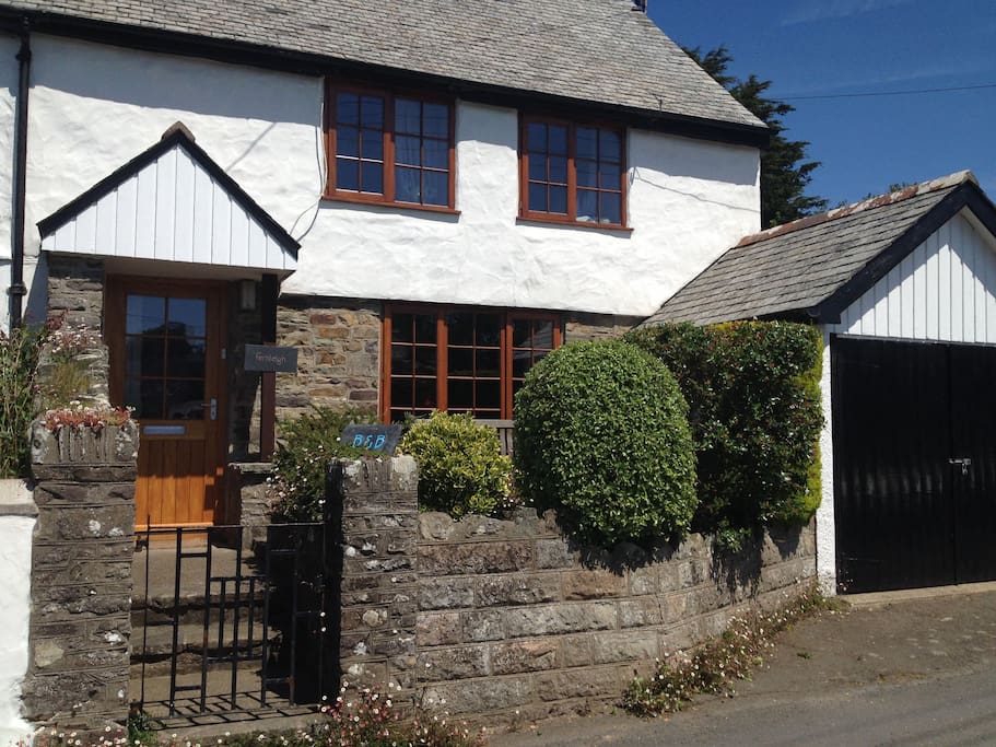 Period property with wood beamed ceilings, exposed stonework and wood burning stove.