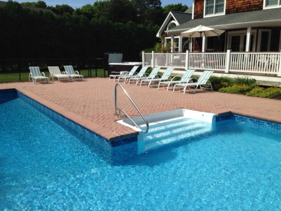 18 lounge chairs total 20x40 L pool with slide diving board. 12x32 shallow end with steps