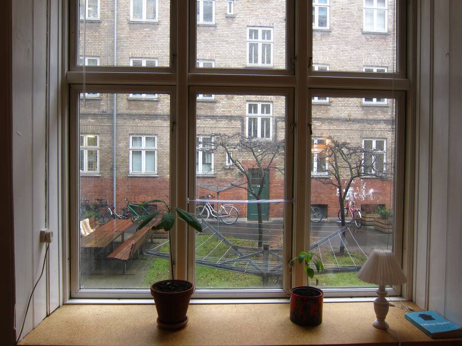 A quiet room with a courtyard outside the window