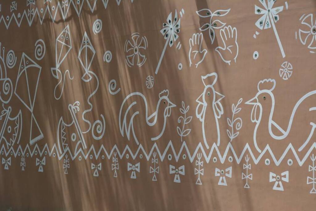 folk art wall -parking area