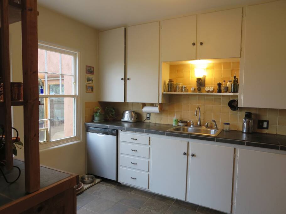 Kitchen is compact, well laid out, with modern appliances