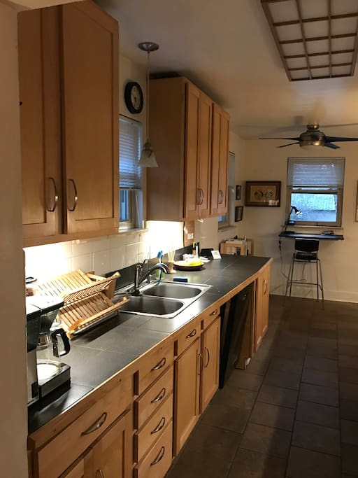 Dishwasher and washer/dryer are located under counters