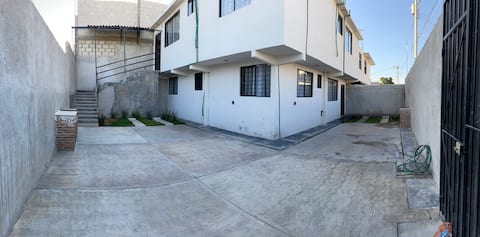 Two apartments for 22 people with parking