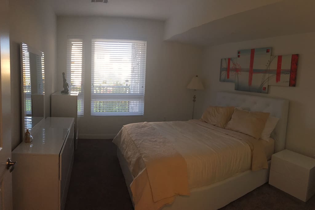 Bedroom with lots of light and has a riverside view