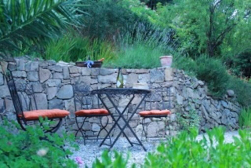 Pretty little garden terrace looking out over port and sea.