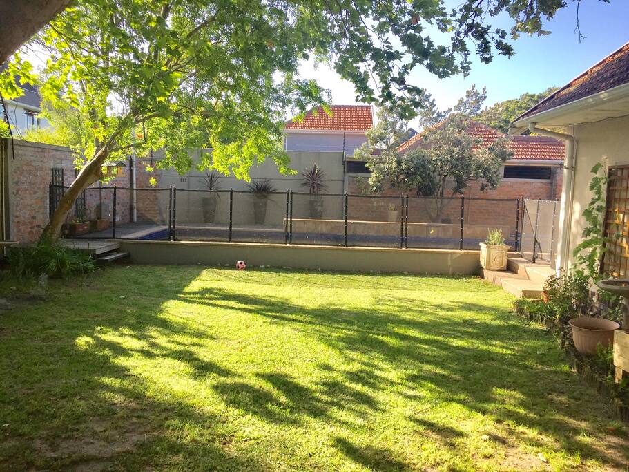View from patio of the pool and garden