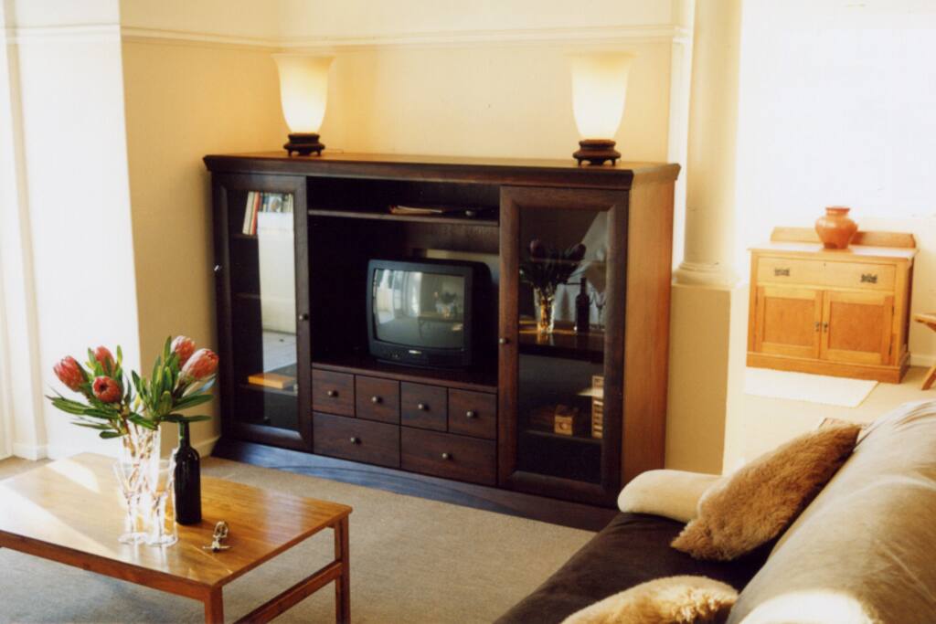 Living room leads to balcony with view of Table Mountain
