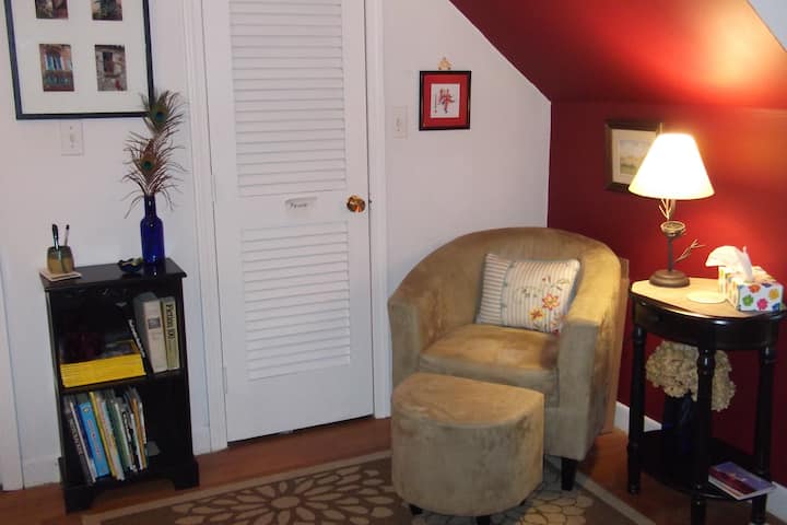 Second bedroom, comfy chair in reading area