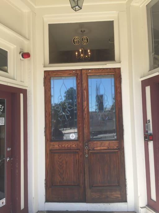 This door is the entrance to the apartment building. We are located in between the commercial businesses - Collective Copies and Laughing Dog Bicycles. Veracruzana is a great Mexican spot with highly recommended margaritas and that is just next door as well.