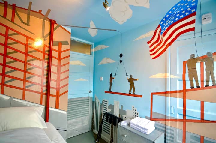 The 3rd class hand made bedroom depicting the dream of an Irish worker building the sky scrapers in New York. The bed is hand made with the 360 degree painting depicting being on the construction site looking down on the streets of new York.