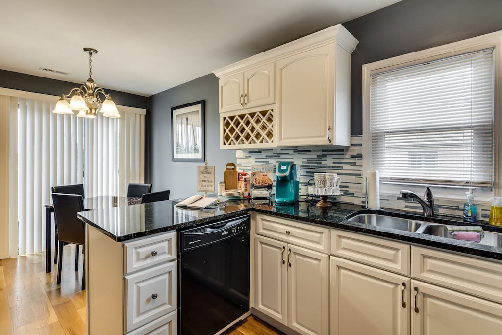 Fire Extinguisher and first aid kit in cabinet beneath sink