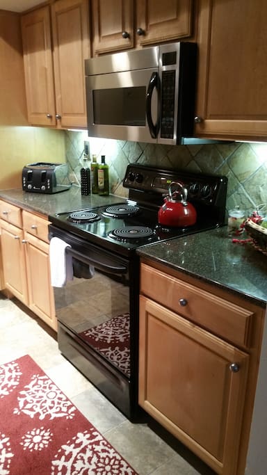 well-equipped kitchen with coffee maker and a variety of Teas.