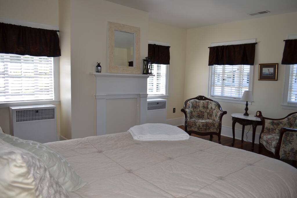 Queen bed and sitting area. Free standing wardrobe armoir.