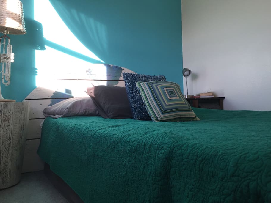 View of bedroom which has curtained doorway rather than a door.