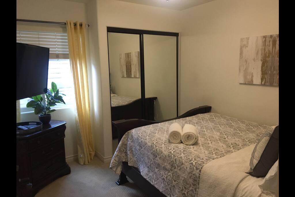 Your private room with a large closet, empty drawers, and hundreds of tv channels. Hangers are provided in the closet
