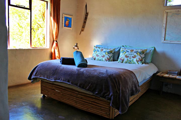 Main bedroom, with views on the Swartberg mountain range.  In winter the sun streams into the bedroom, while in summer it is totally shaded. Percale linen and towels are provided