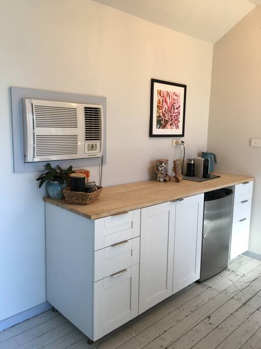 Clean and modern kitchenette.