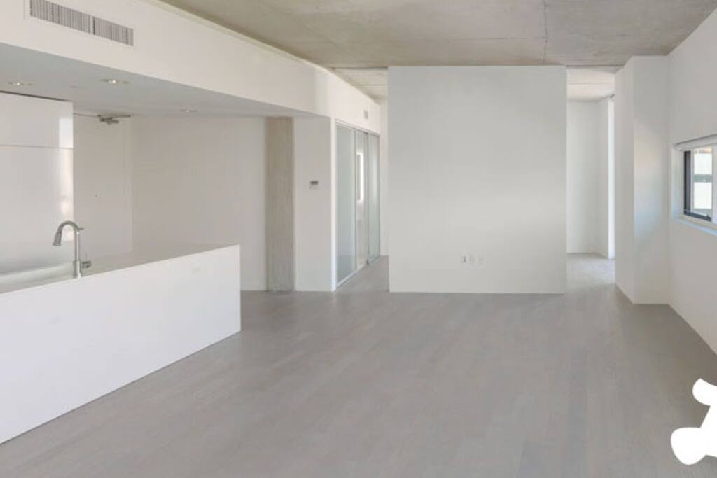 Living room and kitchen- note that it is occupied with furniture