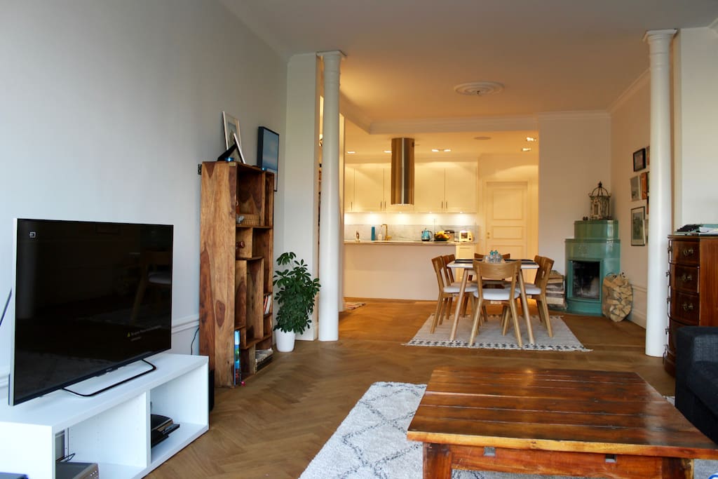 Main apartment space showing the living area with TV on the left and sofa to the right