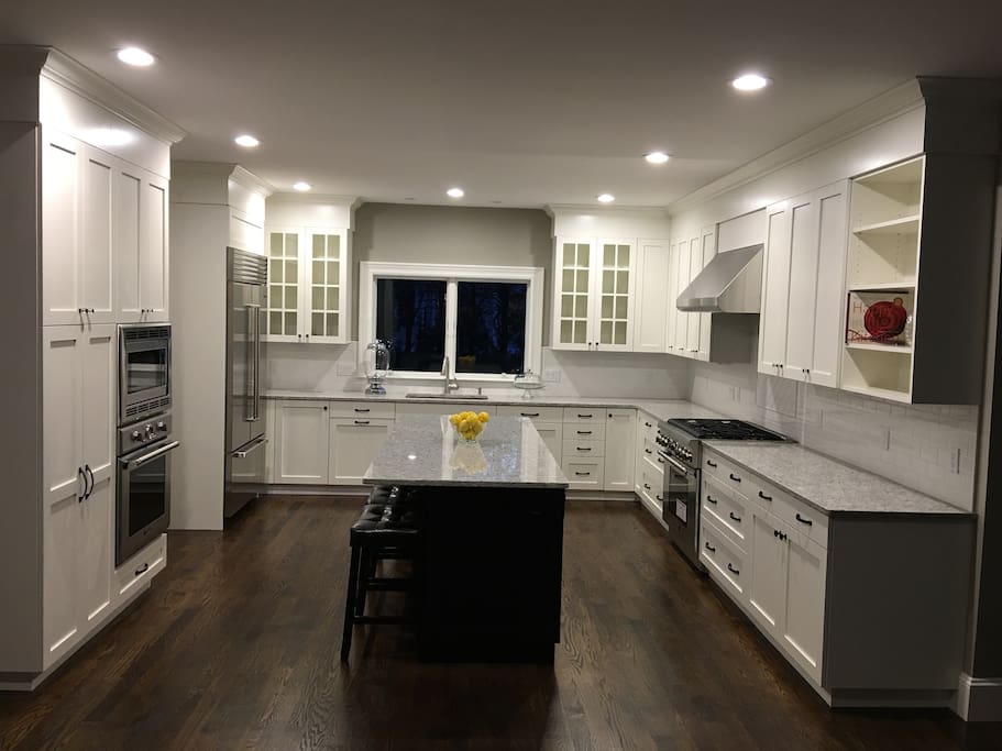 Designer cabinets and Sub Zero fridge, with Thermador gas stove and appliances