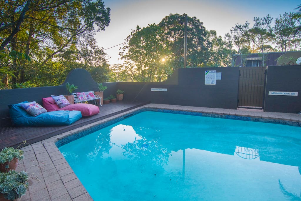 Cool down in the pool area complete with comfortable sun loungers and a dining area