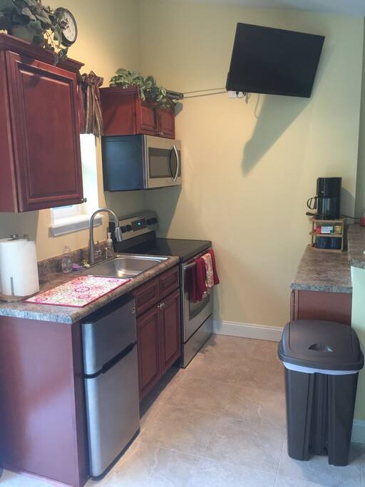 Full kitchen with microwave and coffee maker