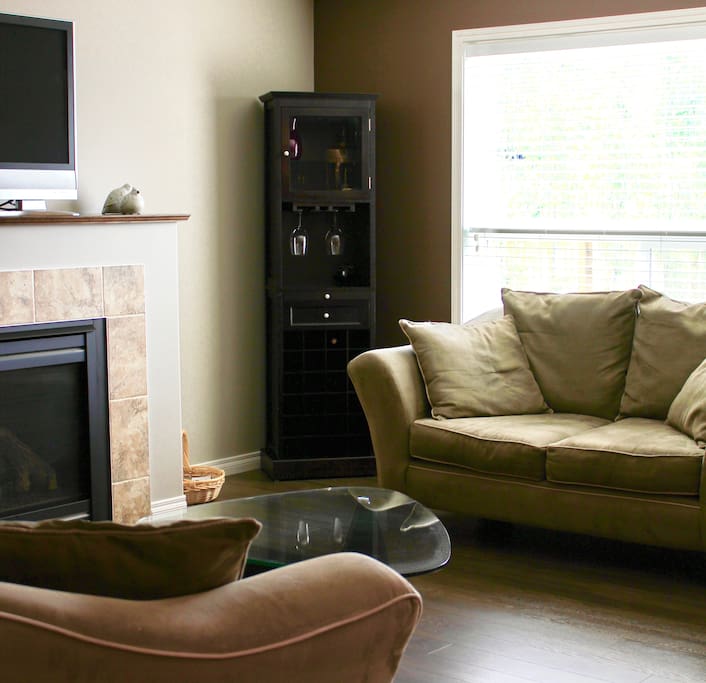 Relax on the couch overlooking the spacious back yard.