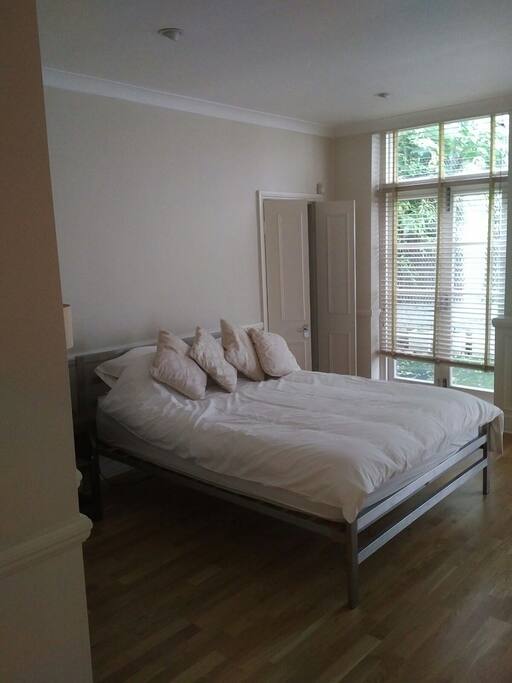 Master Bedroom with Dressing room and ensuite bathroom with walk in shower wet room and patio area