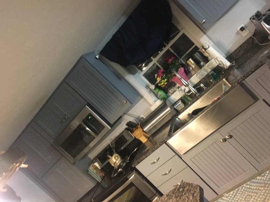 Kitchen with all stainless appliances and a dishwasher and microwave