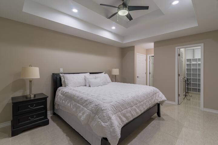 Bedroom 2 has a king size bed, walk-in closet, tv w/ Roku, and a full bathroom.