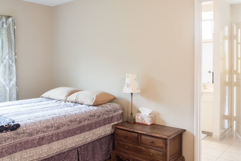Bedroom opens to the private bathroom.