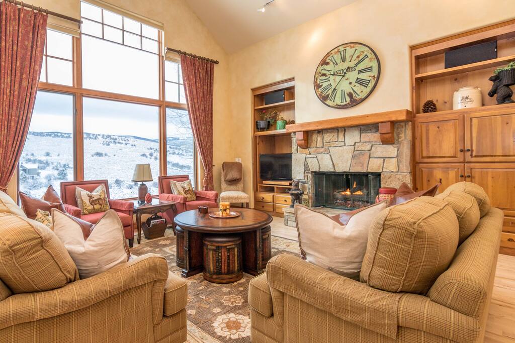 Big windows in the living room provide lovely vistas of the rolling hillsides.