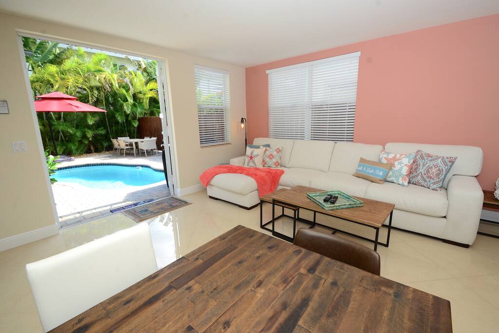 Spacious Open Living Area Features Leather Sectional Sofa + Dining + LED HD TV + Direct Pool Lounge Access...