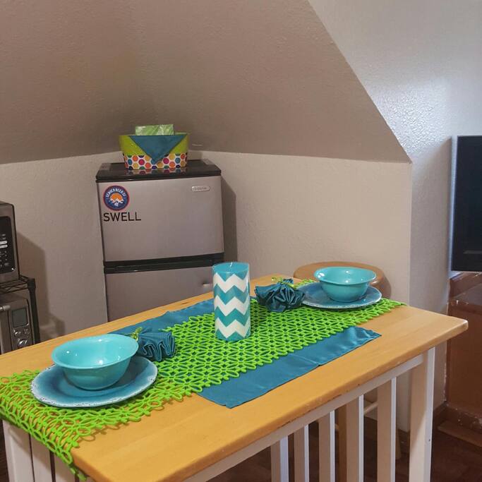 Refrigerator, microwave and toaster in kitchen